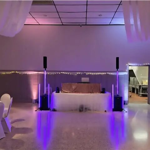 DJ Betty reception setup with purple lighting